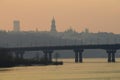 Paton bridge and Kyiv Pechersk Lavra bell tower and Lavra orthodox church silhouette at sunset, Ukraine