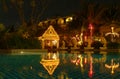 Patong, Phuket, Thailand - 02 December 2009: night view, gazebo illuminated with lights and garlands, lights reflected into the po