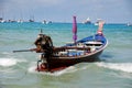 Patong, Thailand: Thai Longboat in Ocean Royalty Free Stock Photo