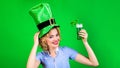 Patricks Day pab party. Happy woman in leprechaun hat with green beer. Smiling girl in green hat drinking green beer Royalty Free Stock Photo