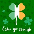 Erin go bragh. Lettering typography with four leaf clover in colors of Ireland flag. Royalty Free Stock Photo