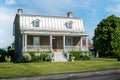 Patrimonial white house with Mansard metal roof in Laval Quebec Royalty Free Stock Photo