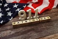 911 Patriot Day Word alphabet letters with USA flag on wooden background Royalty Free Stock Photo