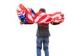 Patriotic american boy holding USA flag waving in the wind isolated on white background. Patriotic holiday. USA celebrate 4th of Royalty Free Stock Photo