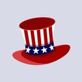 Patriotic American top hat in the red, white and blue colours of the Stars and Stripes at a jaunty angle on a white background