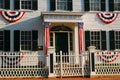 Patriotic bunting is strewn on a historic home Royalty Free Stock Photo