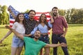 Patriotic celebration of independence of America on July 4. Friends smiling with america flag celebrate usa independence Royalty Free Stock Photo