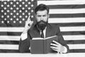 Patriotic concept. American lawyer teacher or tv host hold book american flag background. Love homeland. Man with beard