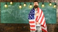 Patriotic education concept. Teacher teaches to love homeland, USA. Man with beard and mustache on serious face with Royalty Free Stock Photo