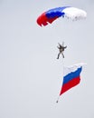 Patriotic flight of a parachutist with the Russian flag Royalty Free Stock Photo