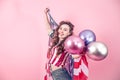 Patriotic girl with the flag of America on a colored background Royalty Free Stock Photo