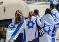 The patriotic girls wrapped in Israeli flags celebrate Israel Independence day
