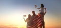 Patriotic holiday, family with American flag Royalty Free Stock Photo