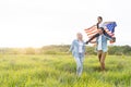 Patriotic holiday. Happy family, parents and daughters children girl with American flag outdoors. USA celebrate 4th of Royalty Free Stock Photo