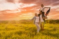 Patriotic holiday. Happy family, parents and daughters children girl with American flag outdoors. USA celebrate 4th of Royalty Free Stock Photo