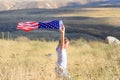 Patriotic holiday. Happy kid, cute little child girl with American flag. National 4 july. Memorial day. Royalty Free Stock Photo