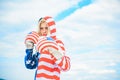 Patriotic holiday. Young beautiful American woman boxer with boxing glove. American woman Ready to knock.