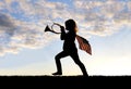 Patriotic Little Girl Child Blowing French Horn and Carrying American Flag Royalty Free Stock Photo