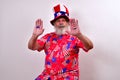 Patriotic man with funny uncle sam hat showing his I voted stickers