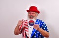Patriotic man holding a vote sticker
