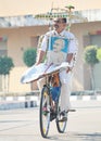 Patriotic person riding a bicycle