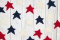 Patriotic red, white and blue stars on weathered whitewash textured wood background Royalty Free Stock Photo
