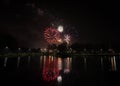 Patriotic Red White and Blue Fireworks with Reflections in Water