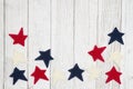 Patriotic red, white and blue stars on weathered whitewash textured wood background Royalty Free Stock Photo