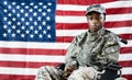 Patriotic Soldier Sitting In Wheel Chair Royalty Free Stock Photo