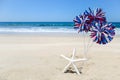 Patriotic USA background with starfish on the sandy beach Royalty Free Stock Photo