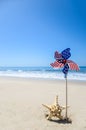 Patriotic USA background with starfish on the sandy beach Royalty Free Stock Photo