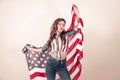 Patriotic girl with the flag of America on a colored background Royalty Free Stock Photo