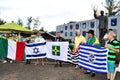 Patriots hold several flags in front of the DCTA in a moment of prayer at the demonstration