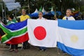 Patriots pray with the flags of different nations in front of the DCTA at the demonstration