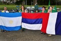Patriots pray with the flags of different nations in front of the DCTA at the demonstration