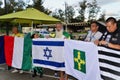 Patriots pray and hold flags in front of DCTA at the rally