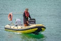 Patrol boat policing self drive hire boats in the bay at St Ives, Cornwall, UK