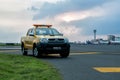 Patrol car at Juanda International Airport, Surabaya, Indonesia. the double cabin type is ready to stand by in the runway area Royalty Free Stock Photo