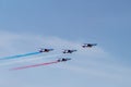 The patrol of France, french national day, blue white red flag, planes, acrobatic figures, blue sky, military parade