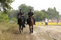 Patrol of mounted police keeping order in the city park