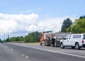 Patrolman stopped big rig tip truck and goes to inspect it