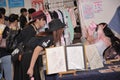 Patrons enquiring about the merchandise at Cosfest in Singapore