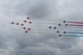 Patrouille de France Alpha Jet and RAF Red Arrows in Flight together Royalty Free Stock Photo