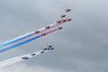 Patrouille de France Alpha Jet and RAF Red Arrows in Flight together Royalty Free Stock Photo