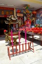 Chinese temple door flags joss urn and King portrait Pattani Thailand