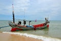 Sea going fishing vessel boat parked on beach in Pattani village Thailand