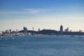 Pattaya bay in day time. Cityscape with boats, beach, buildings, mountains. Famous city in Chonburi province, Thailand.