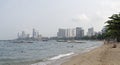 Pattaya Beach. People sit on the sand, some swim in the sea Royalty Free Stock Photo