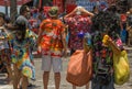 A man with a black mask is creating colorful bubbles with toys,while people celebrating Songkran Royalty Free Stock Photo