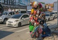 PATTAYA,THAILAND - APRIL 18,2018: North Pattaya Road A Thai woman is selling masks and water pistols for Songkran.